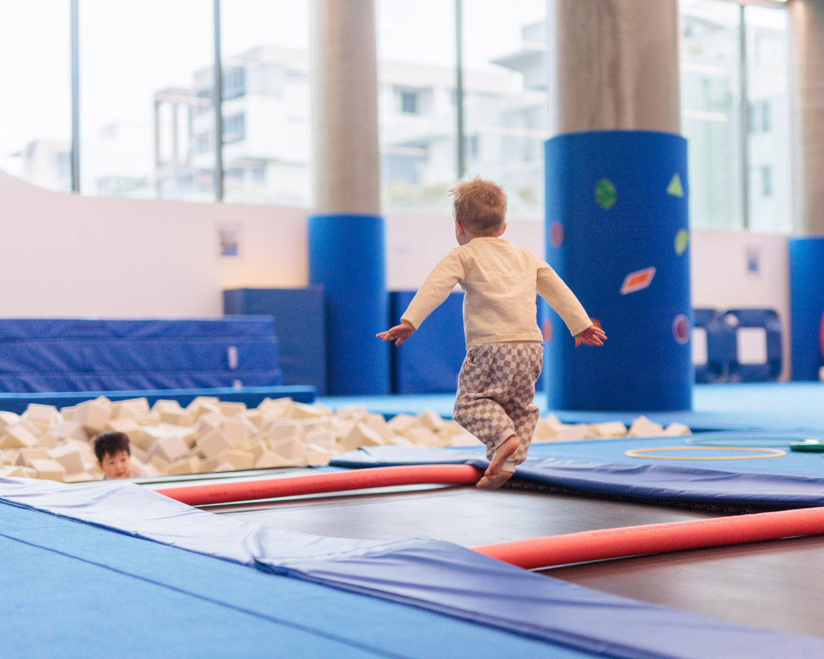 Kid jumping on trampoline