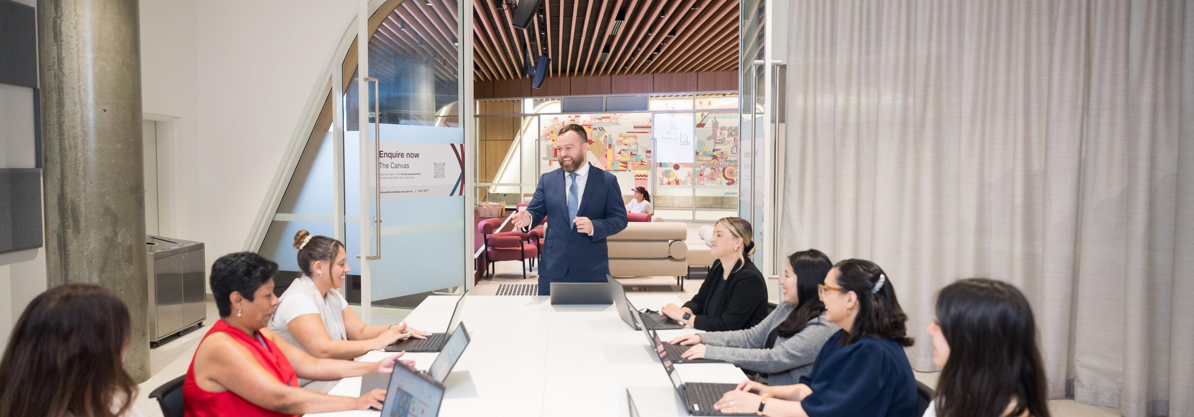 A business person presents a seminar in The Canvas