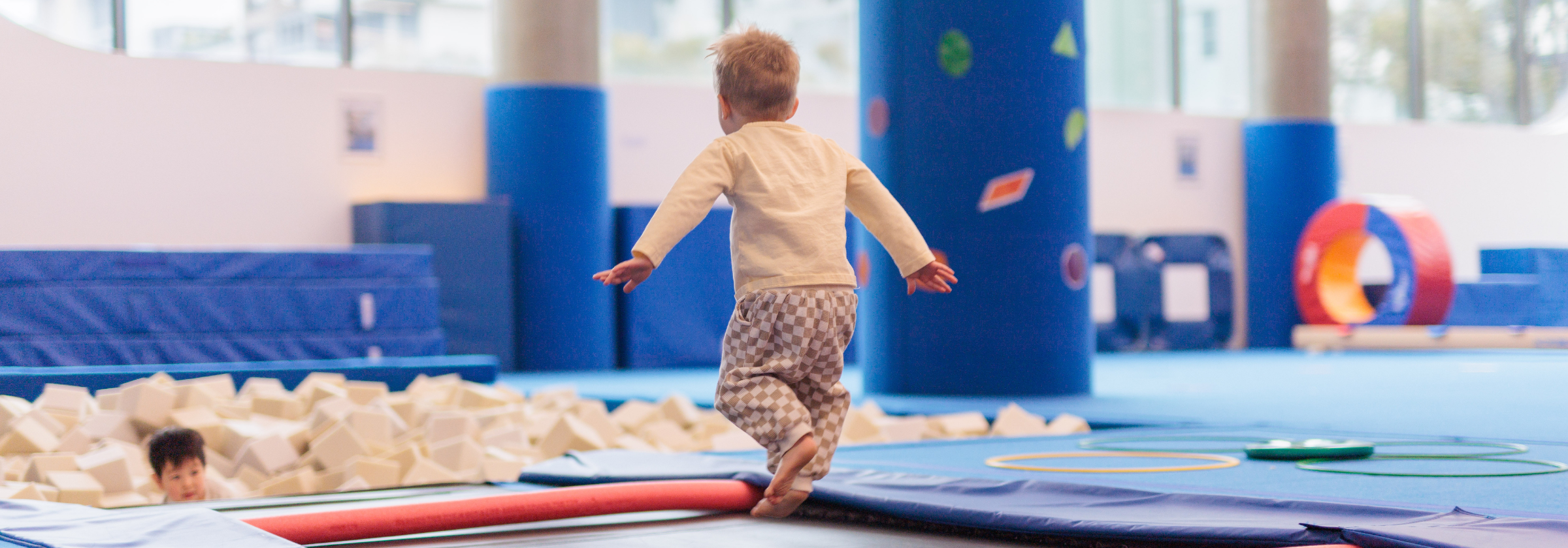 Child prepares to jump into foam pit