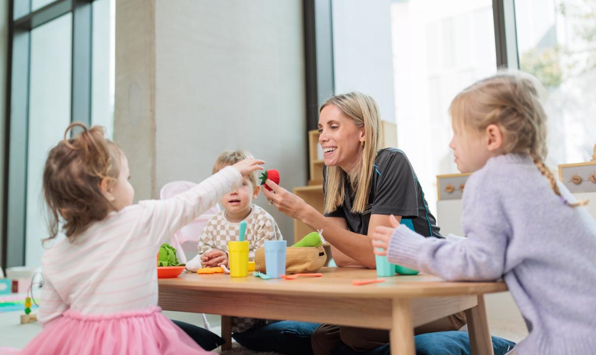 Kids at the creche with staff member