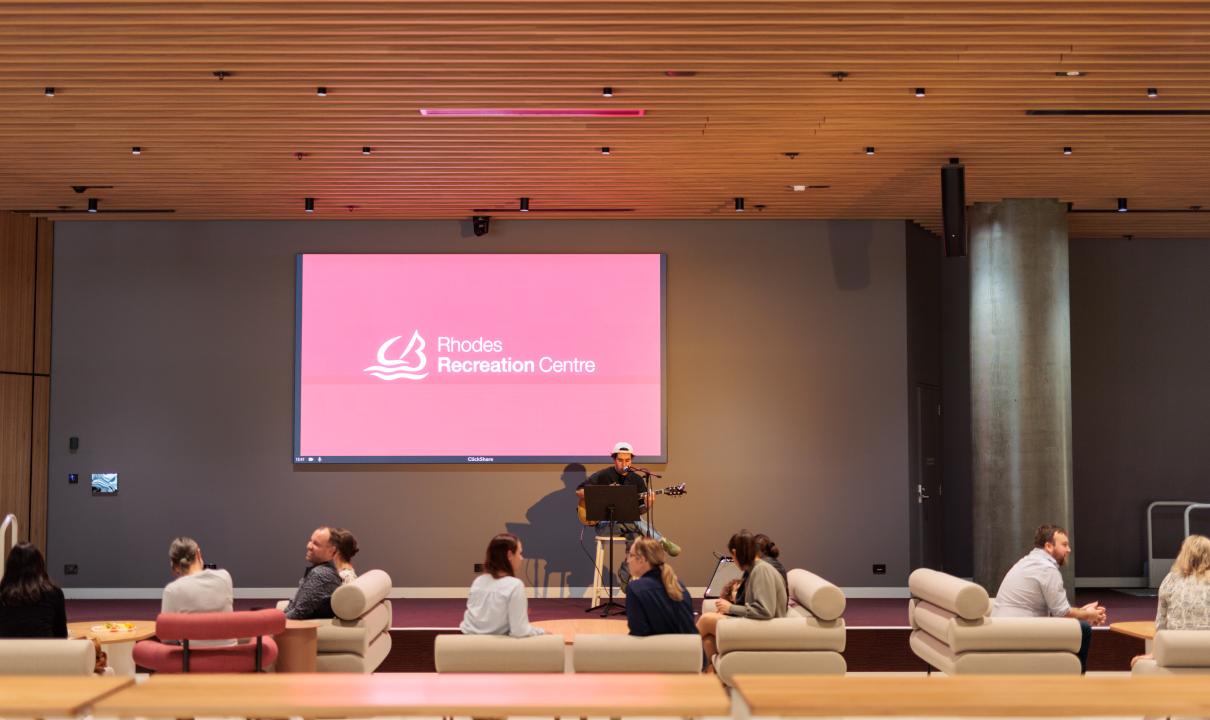 Person performing in community hub